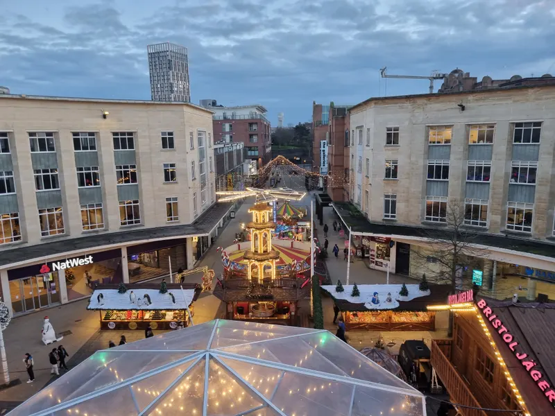 Bristol Christmas Market stalls and glass-roofed bar seen from above