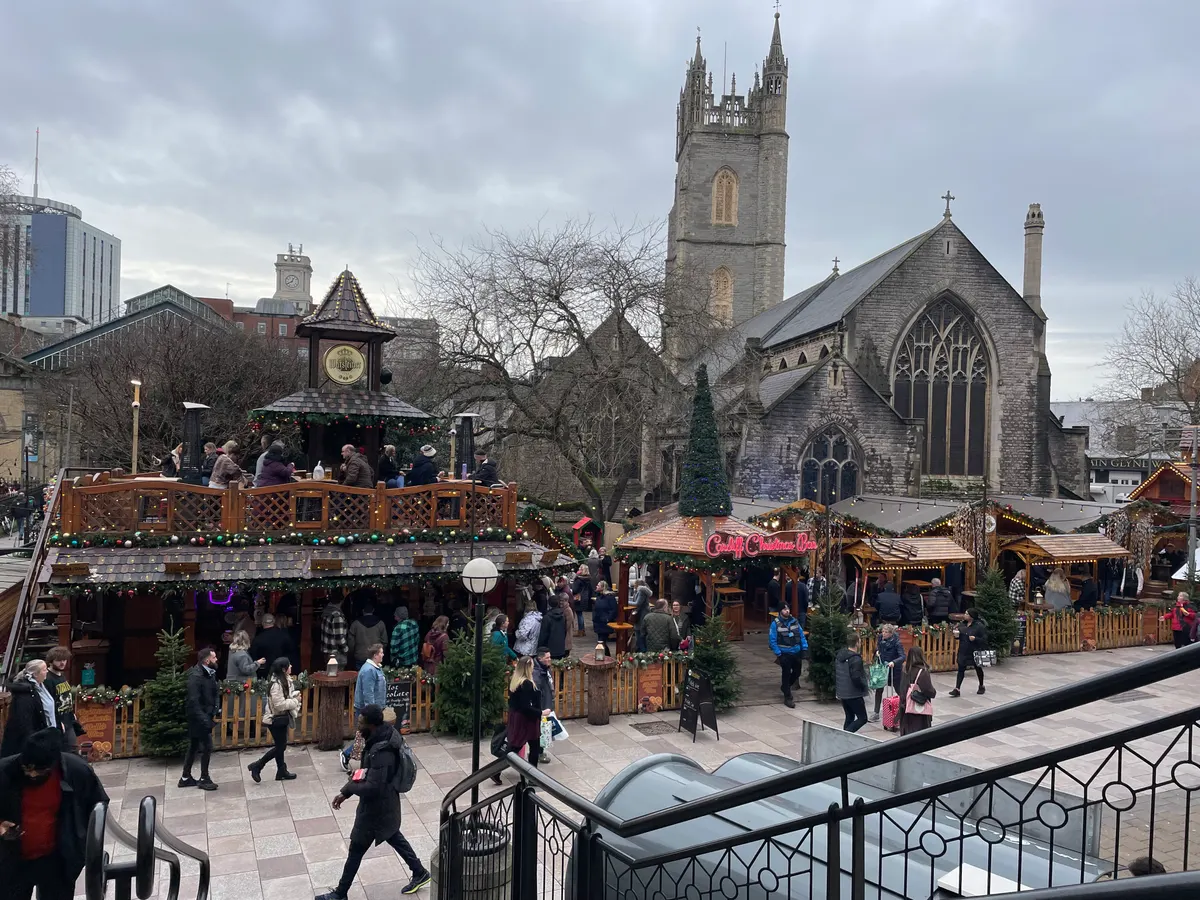 Christmas market chalets beside St John's Church in Cardiff