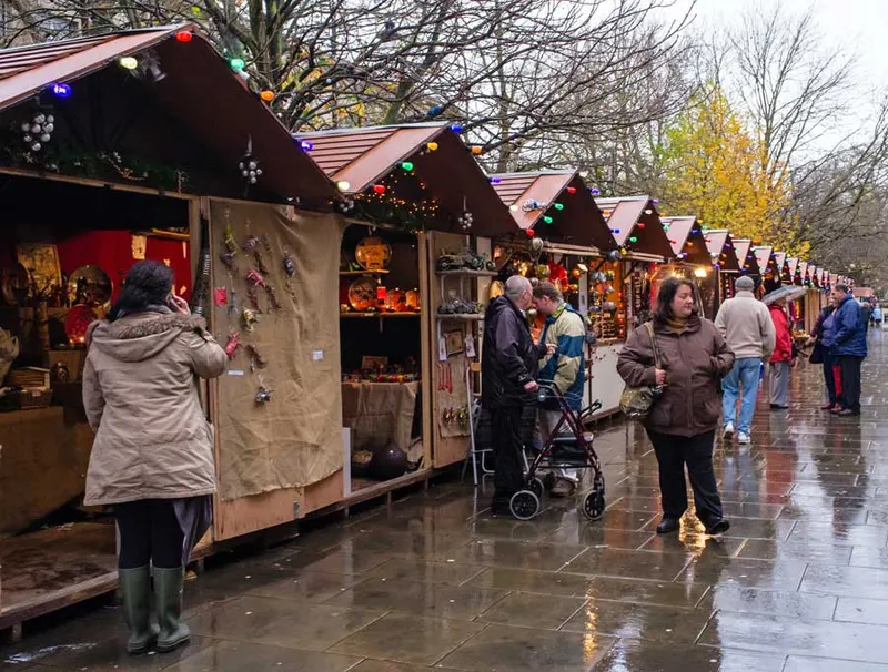 Visitor browsing a chalet at Cheltenham Christmas Market