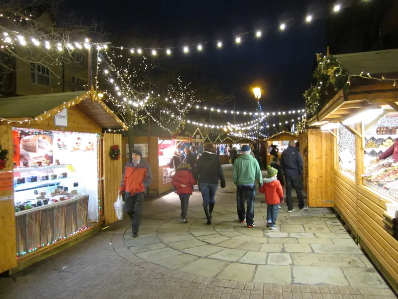 Chester Christmas Market stalls beneath string lights