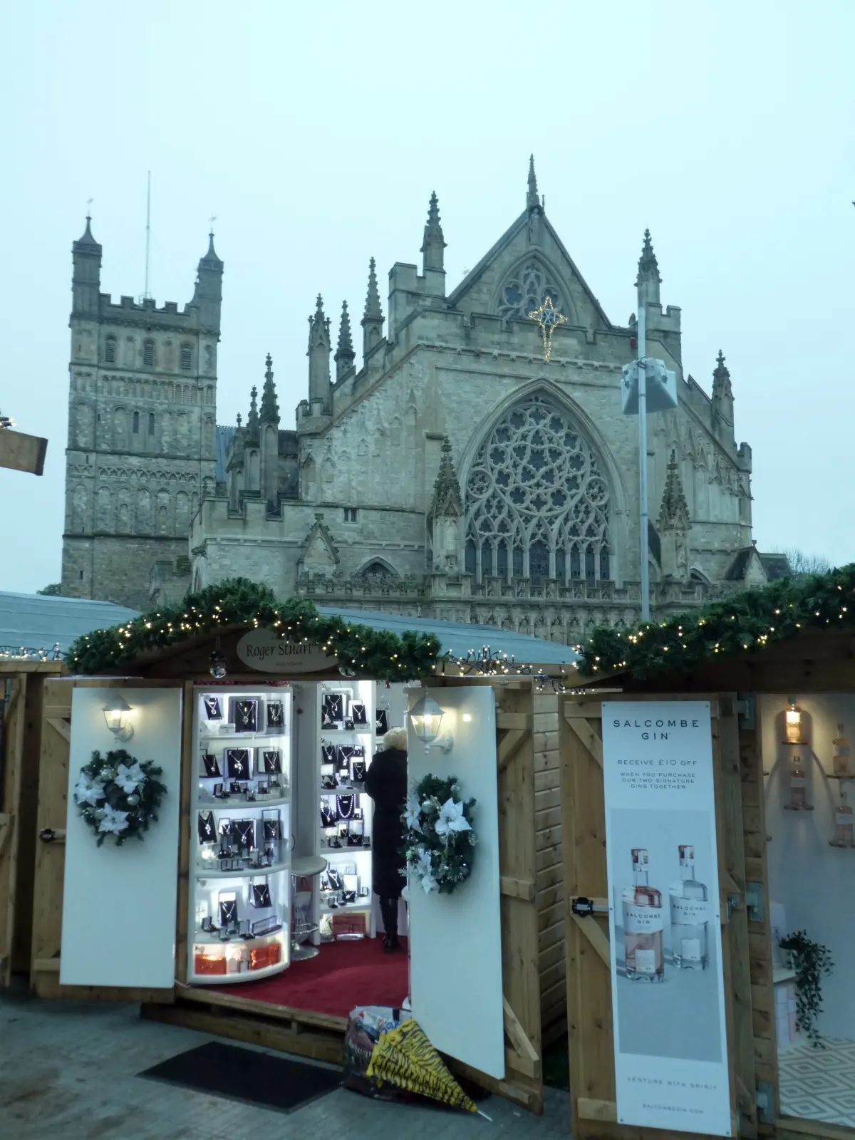 Christmas market chalet in front of Exeter Cathedral
