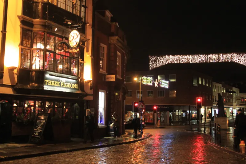 Guildford High Street pub and Christmas lights in the evening