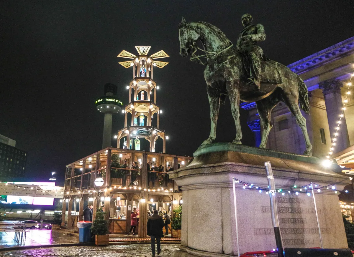 Christmas pyramid bar by St George's Hall in Liverpool at night