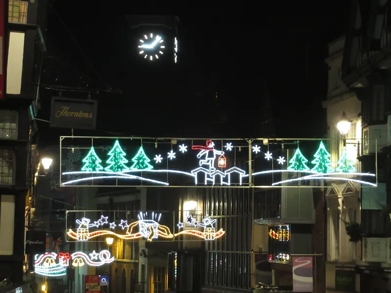 Christmas light displays above a Shrewsbury street at night