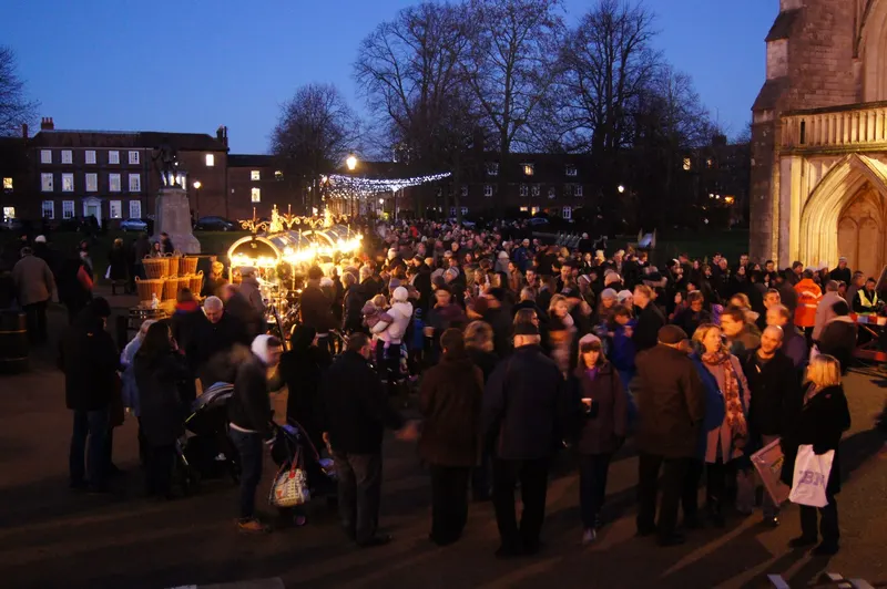 Crowds gathering in the cathedral grounds at Winchester Christmas Market