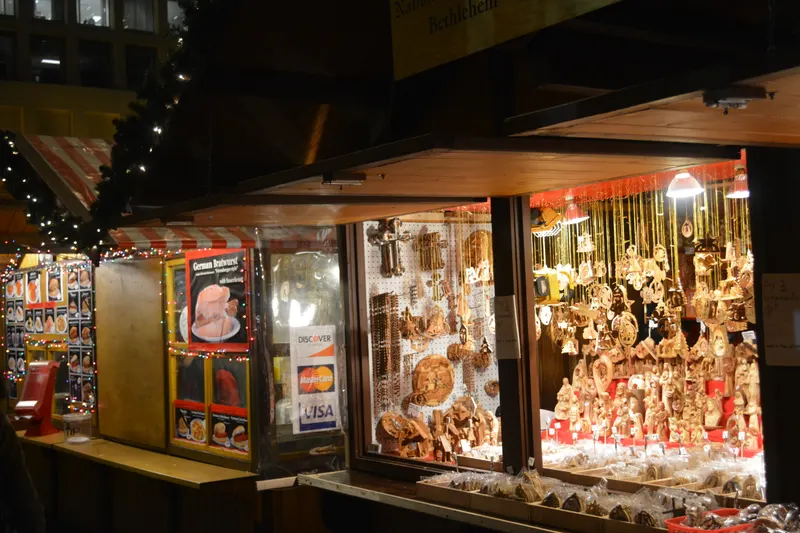 Stall full of glass ornaments at Christkindlmarket Chicago in the evening