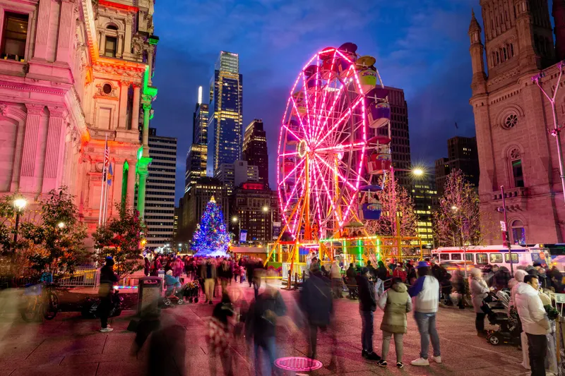 Ferris wheel lit up at night at Christmas Village in Philadelphia