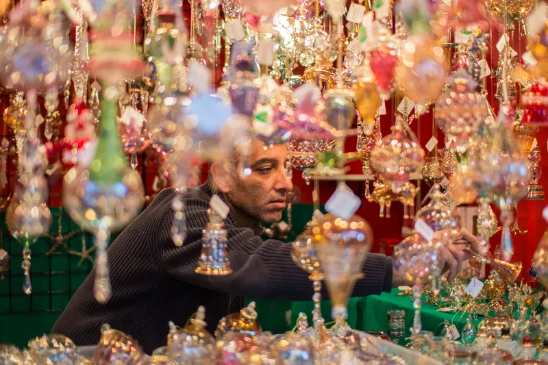 Vendor selling glass ornaments at Christmas Village in Philadelphia