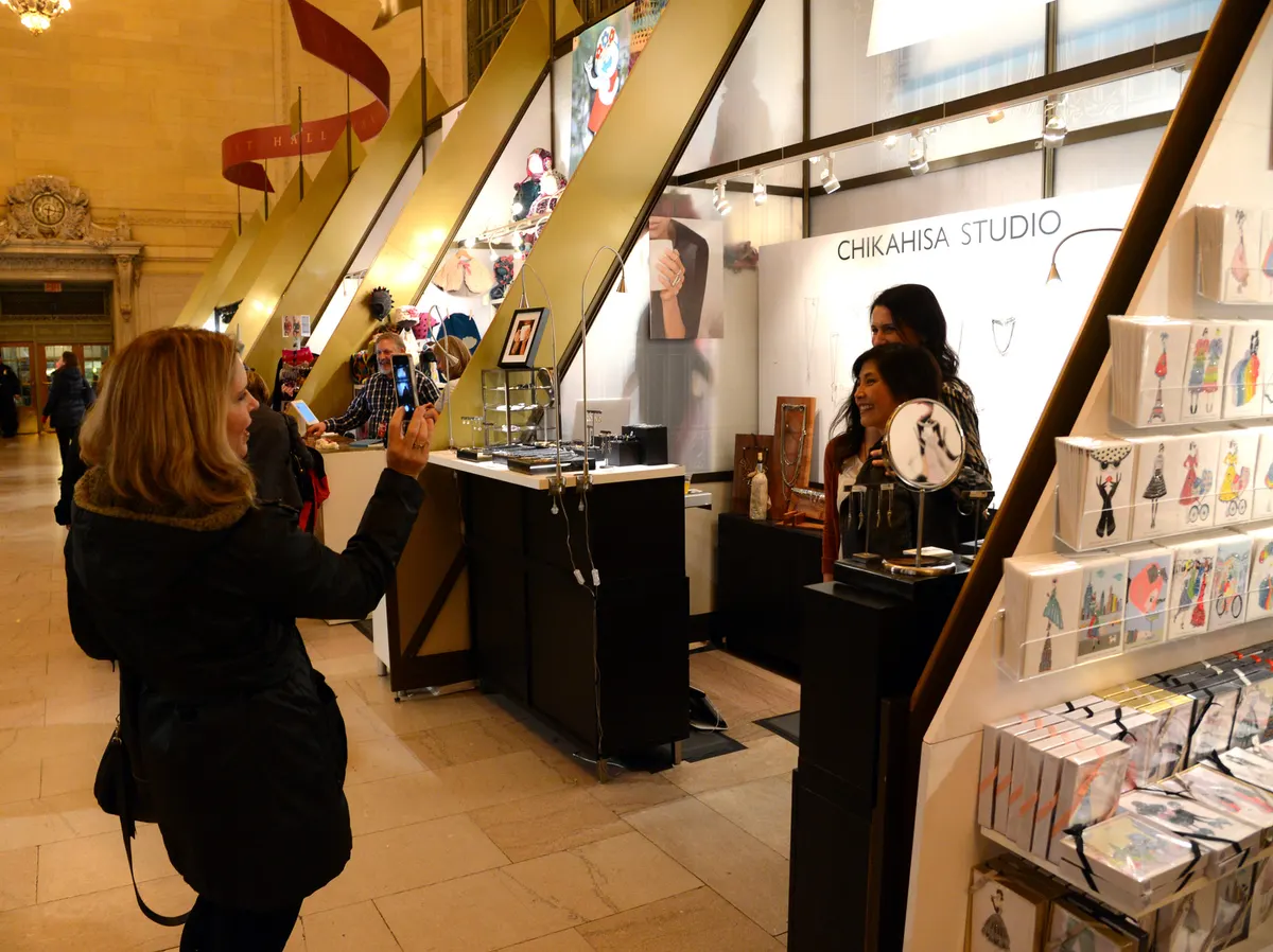 Shoppers browsing stalls at the Grand Central Holiday Fair in Vanderbilt Hall