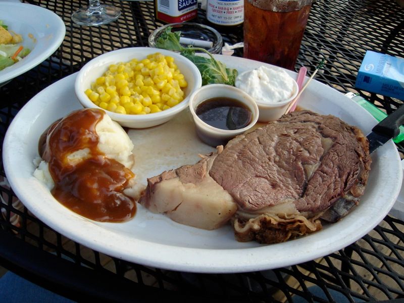 A slice of prime rib roast on a plate
